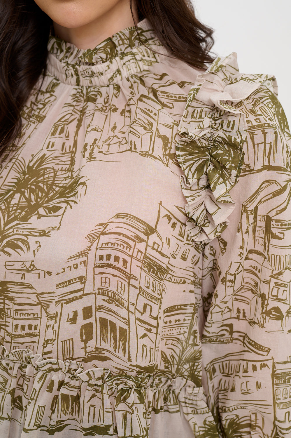Close-up of a blouse with architectural pattern, Alexis Santorini Sketch Blouse, a staple for curated boutique fashion and chic affordable style available at your Womens Boutique West Palm Beach, FL.