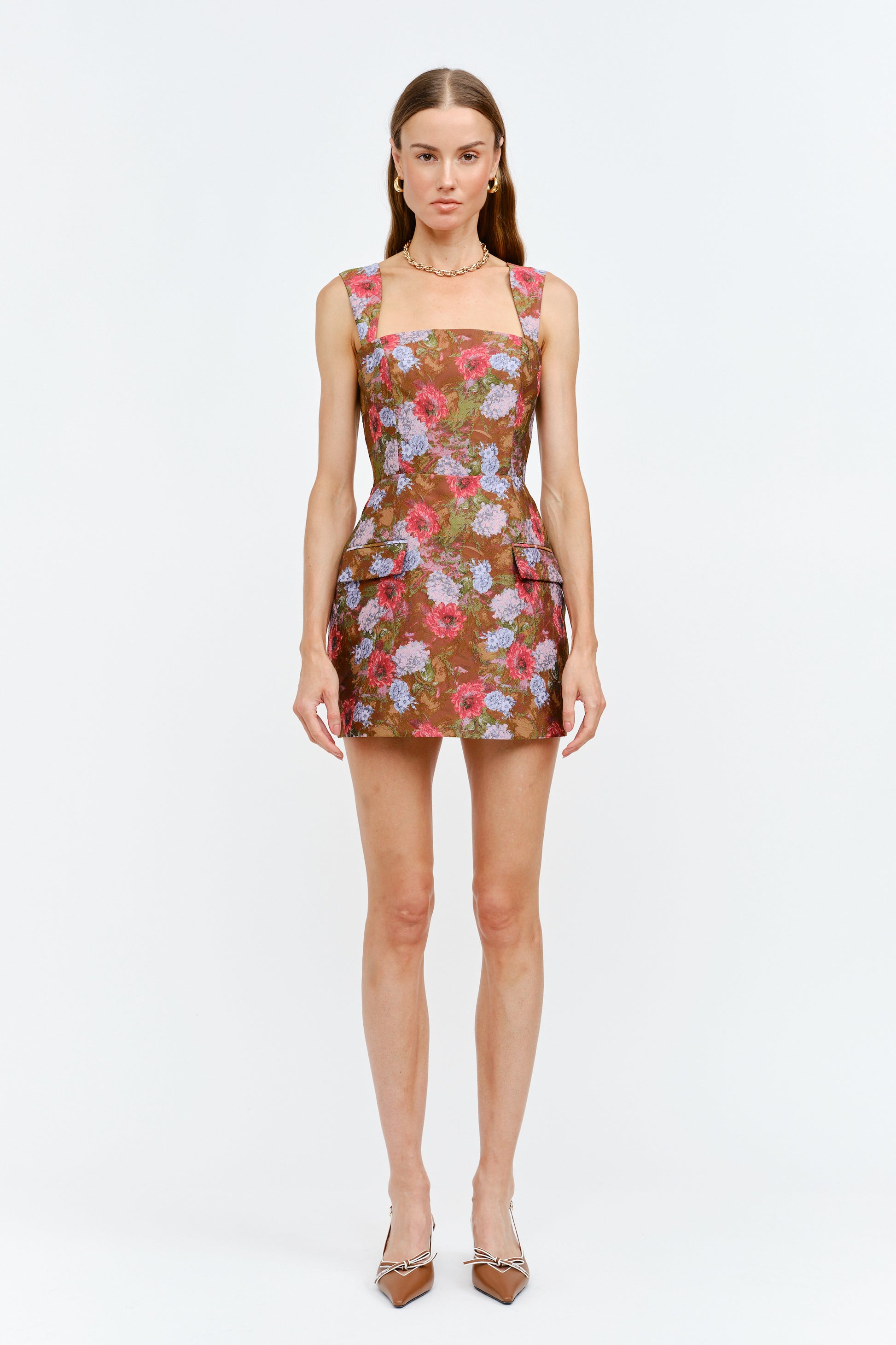 Woman wearing a floral dress on a white background