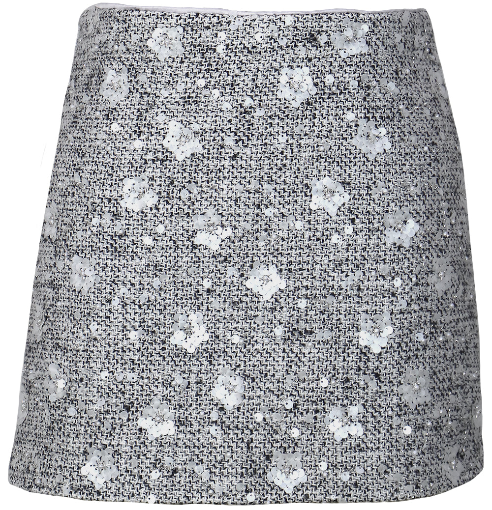 Short skirt with a pattern on a white background, a staple for curated boutique fashion and chic affordable style available at your Womens Boutique West Palm Beach, FL.