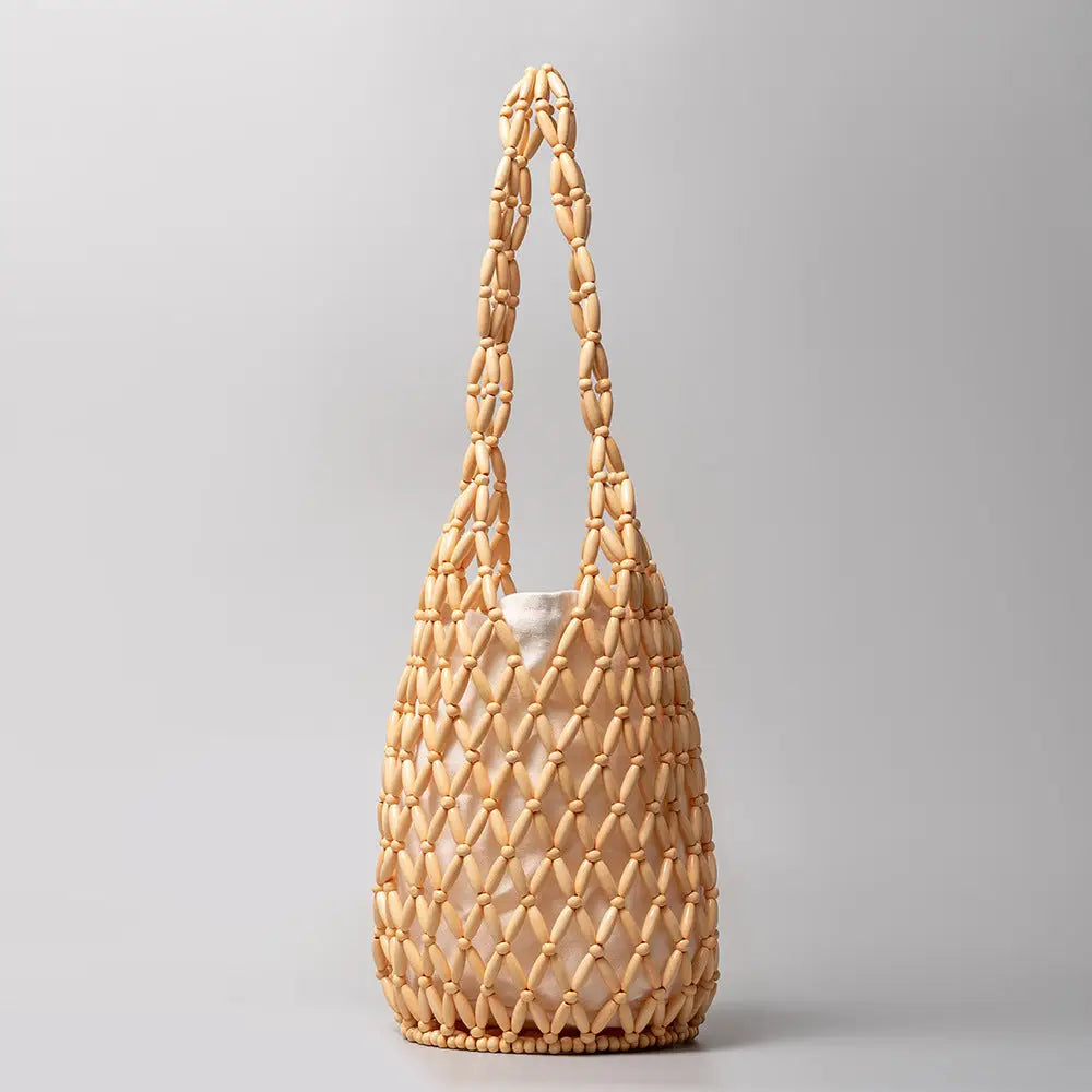 Hanna Hallow Wooden Beaded Handmade Bag, a staple for curated boutique fashion and chic affordable style available at your Womens Boutique West Palm Beach, FL.