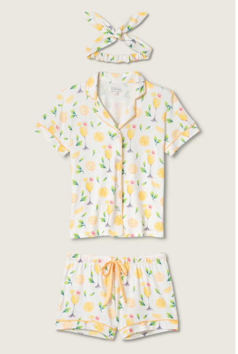 Set of pajama top, shorts, and headband with lemon pattern on a beige background
Maria Mimosa Me PJ Set, a staple for curated boutique fashion and chic affordable style available at your Womens Boutique West Palm Beach, FL.