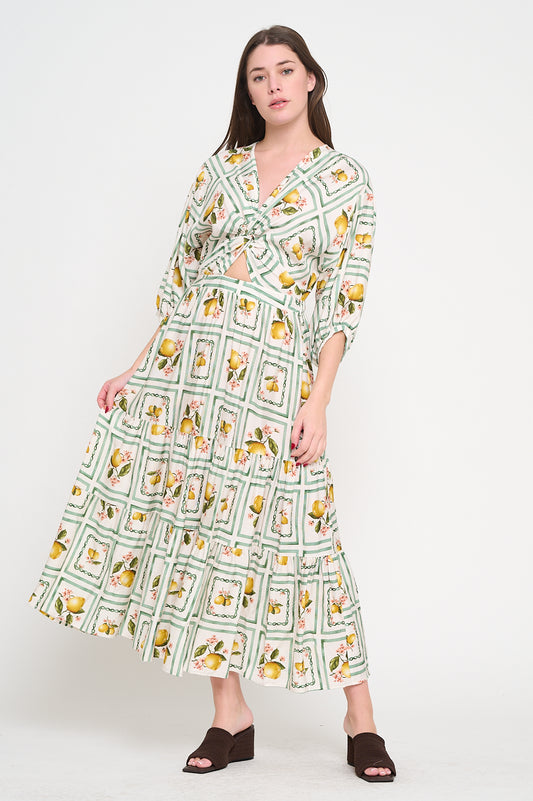 Woman wearing a patterned dress on a white background, Alana 3/4 Sleeve Maxi Dress a staple for curated boutique fashion and chic affordable style available at your Womens Boutique West Palm Beach, FL.