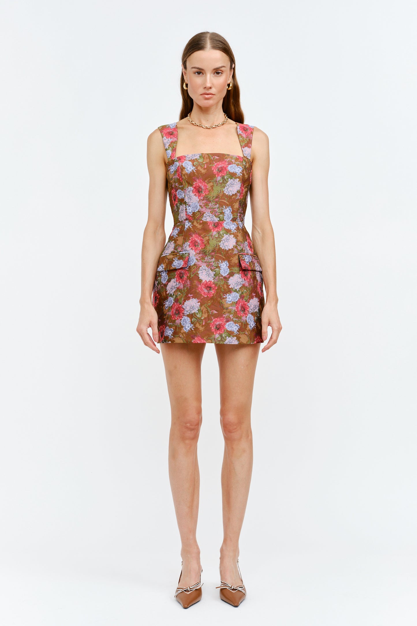 Woman wearing a floral dress on a white background