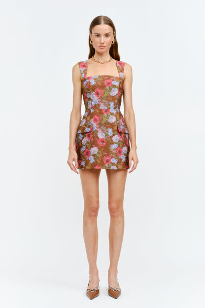 Woman wearing a floral dress on a white background