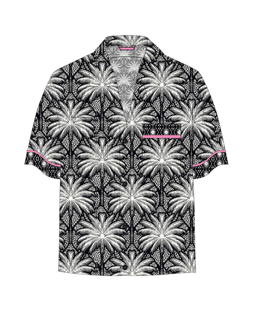 Get ready to turn heads this summer with the Betty Beach Dreams Boyfriend button down shirt! Featuring a chic white and black palm tree print. Perfect for lounging by the beach or stepping out for a fun night, it blends comfort with playful, effortless style. Embrace the sunny vibes and make every day feel like a beach day! A staple for curated boutique fashion and chic affordable style available at your Women's Boutique West Palm Beach, FL