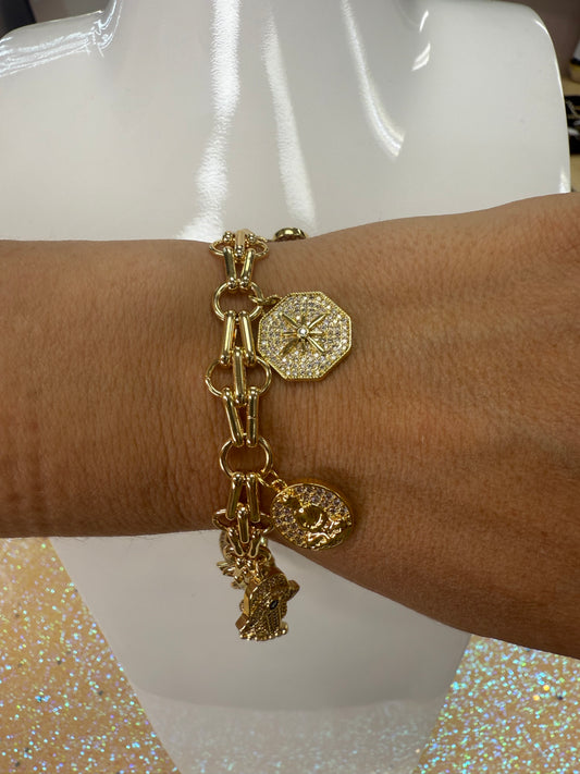 Add a touch of sparkle and fun to your wrist with this charm bracelet featuring a large lobster claw clasp adorned with dazzling cubic zirconia stones. Its playful design makes it perfect for mixing and matching with your favorite charms, adding personality and shine to any outfit. Durable and eye-catching, this bracelet is sure to become your new go-to accessory for everyday adventures. A staple for curated boutique fashion and chic 
style available at your Women's Boutique West Palm Beach, FL
CS101