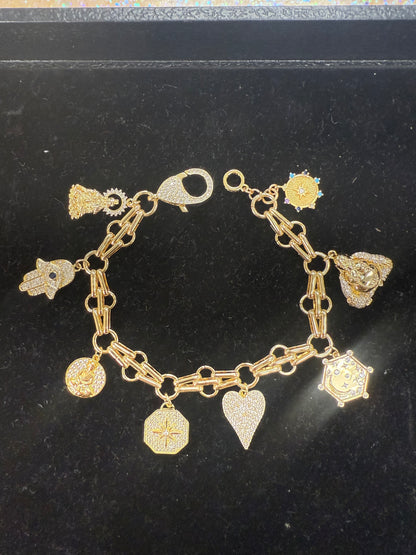Add a touch of sparkle and fun to your wrist with this charm bracelet featuring a large lobster claw clasp adorned with dazzling cubic zirconia stones. Its playful design makes it perfect for mixing and matching with your favorite charms, adding personality and shine to any outfit. Durable and eye-catching, this bracelet is sure to become your new go-to accessory for everyday adventures. A staple for curated boutique fashion and chic 
style available at your Women's Boutique West Palm Beach, FL
CS101
