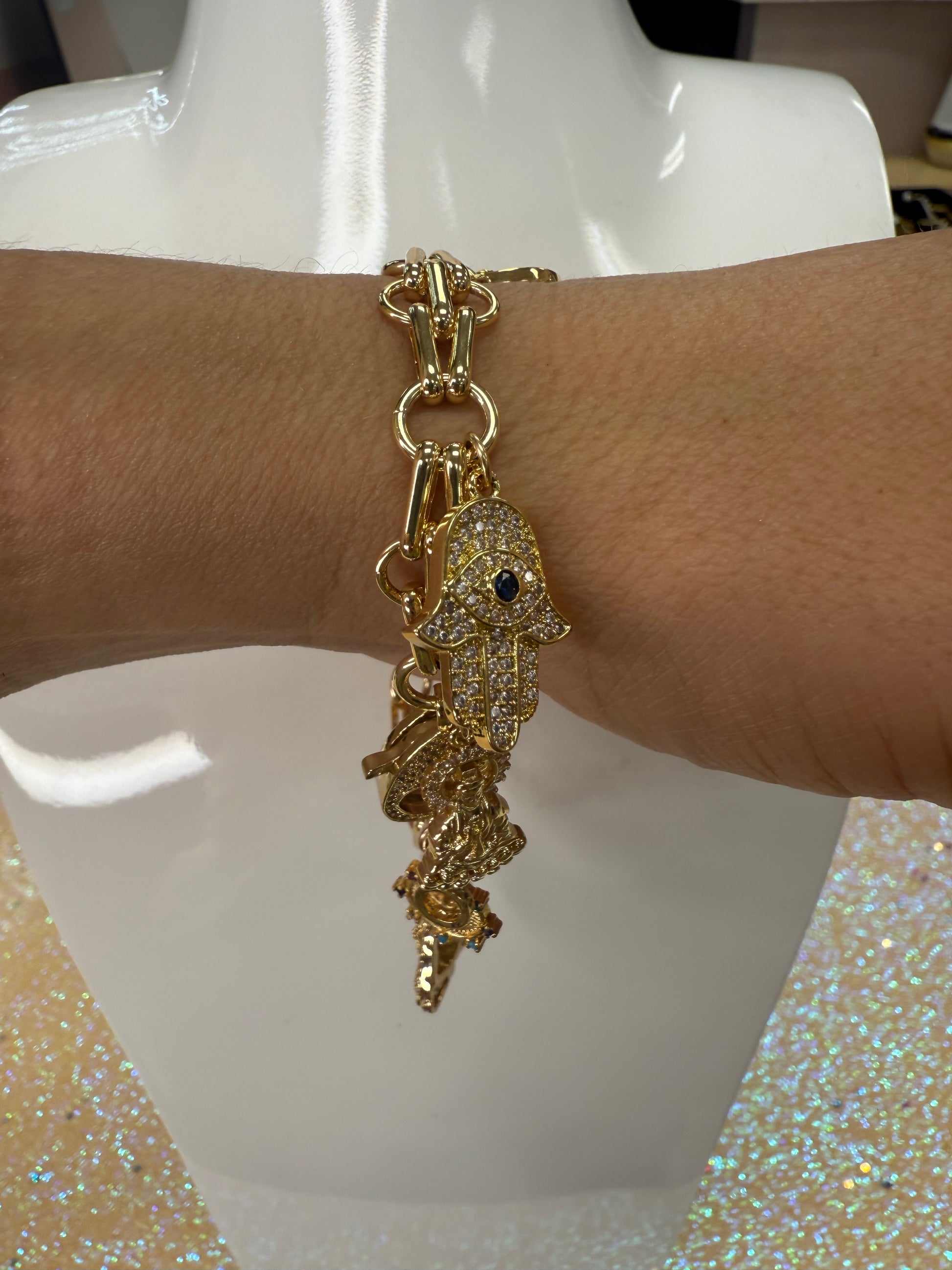 Add a touch of sparkle and fun to your wrist with this charm bracelet featuring a large lobster claw clasp adorned with dazzling cubic zirconia stones. Its playful design makes it perfect for mixing and matching with your favorite charms, adding personality and shine to any outfit. Durable and eye-catching, this bracelet is sure to become your new go-to accessory for everyday adventures. A staple for curated boutique fashion and chic 
style available at your Women's Boutique West Palm Beach, FL
CS101