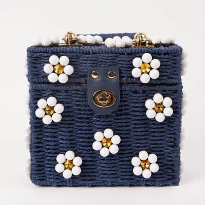Dylan Daisy Wicker Tote,  a staple for curated boutique fashion and chic affordable style available at your Womens Boutique West Palm Beach, FL.