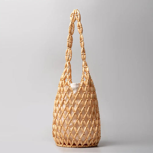 Hanna Hallow Wooden Beaded Handmade Bag, a staple for curated boutique fashion and chic affordable style available at your Womens Boutique West Palm Beach, FL.
