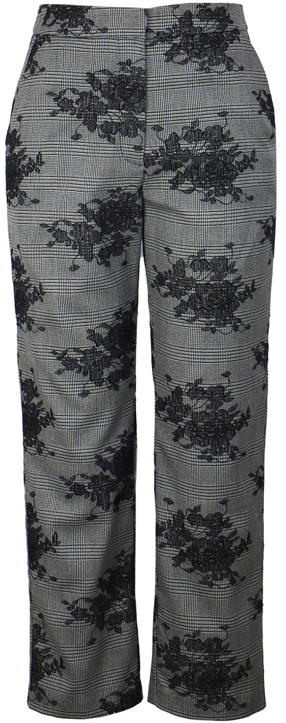 Floral patterned pants on a plain background,a staple for curated boutique fashion and chic affordable style available at your Womens Boutique West Palm Beach, FL.
