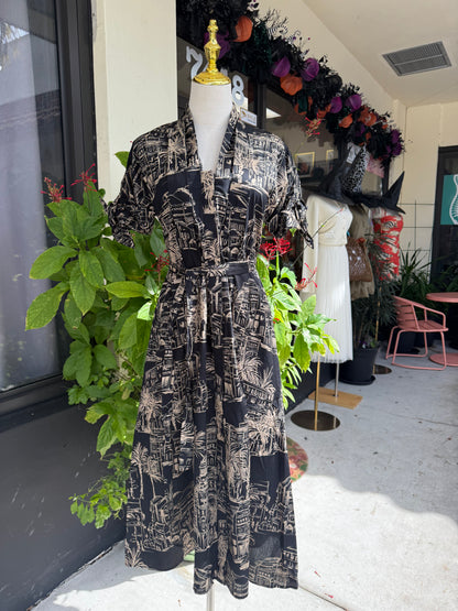 Mannequin wearing a black and white patterned dress with greenery in an indoor setting, Blue tracksuit on a mannequin with a decorative background. a staple for curated boutique fashion and chic affordable style available at your Womens Boutique West Palm Beach, FL.
