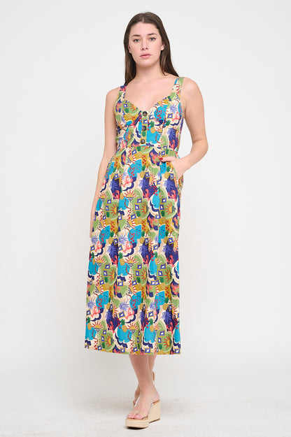 Woman wearing a colorful patterned dress on a white background. Raquel Midi Printed Dress a staple for curated boutique fashion and chic affordable style available at your Womens Boutique West Palm Beach, FL.